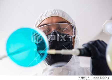 Young male chemist working in the lab Young male chemist working in the lab 66618823