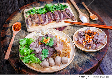Thai food Noodle soup with beef on wood background 66619836