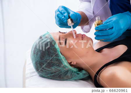 Young woman visiting male doctor dermatologist Young woman visiting male doctor dermatologist 66620961