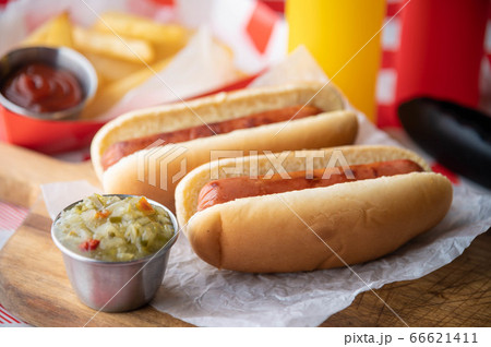 hot dog with french fries on red check table 66621411