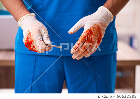 Young male doctor surgeon in fatal negligence concept 66622585