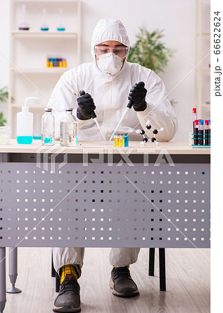 Doctor working in lab in coronavirus COVID-19 concept Doctor working in lab in coronavirus COVID-19 concept 66622624