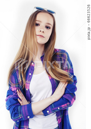 young pretty teenage hipster girl posing emotional happy smiling on white background, lifestyle people concept 66623526