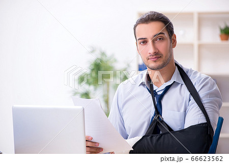 Injured male employee at workplace after accident Injured male employee at workplace after accident 66623562