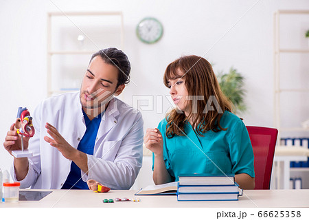 Two doctors colleagues working in the hospital 66625358