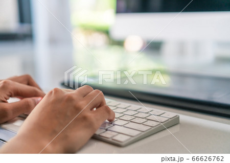 Woman hand using laptop to work study on work desk 66626762