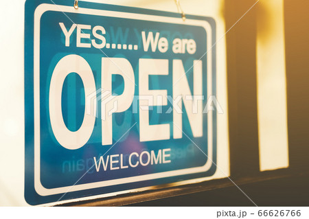 A business sign that says open on cafe or 66626766