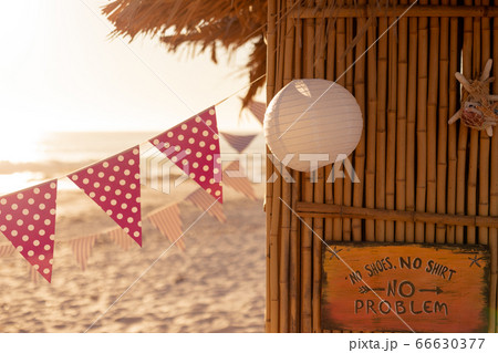 Garland and a hut on beach Garland and a hut on beach 66630377
