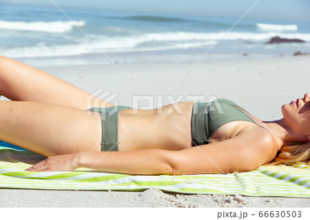 Caucasian woman enjoying at beach Caucasian woman enjoying at beach 66630503