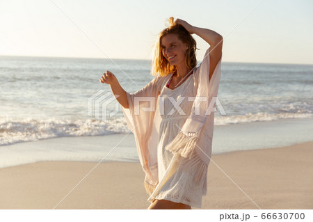 Caucasian woman spending time at beach 66630700