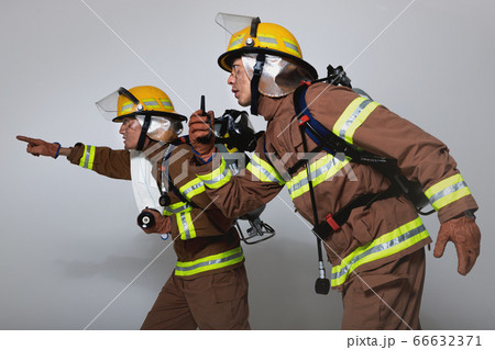 Asian male and female firefighter portrait, young smiling fireman in uniform 465 Asian male and female firefighter portrait, young smiling fireman in uniform 465 66632371