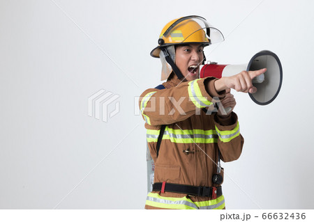 Asian male and female firefighter portrait, young smiling fireman in uniform 414 Asian male and female firefighter portrait, young smiling fireman in uniform 414 66632436