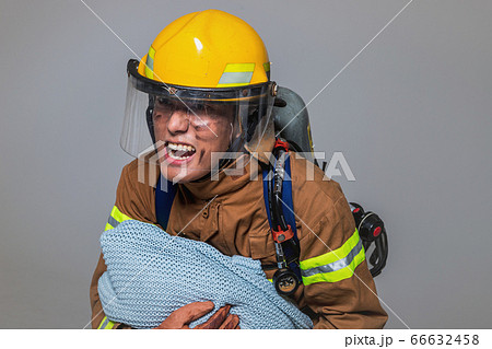 Asian male and female firefighter portrait, young smiling fireman in uniform 499 Asian male and female firefighter portrait, young smiling fireman in uniform 499 66632458