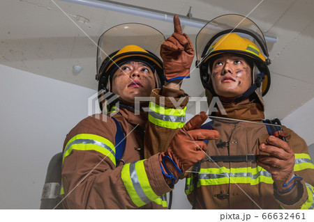 Asian male and female firefighter portrait, young smiling fireman in uniform 521 66632461