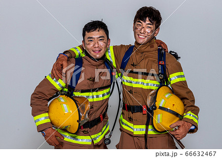 Asian male and female firefighter portrait, young smiling fireman in uniform 519 Asian male and female firefighter portrait, young smiling fireman in uniform 519 66632467