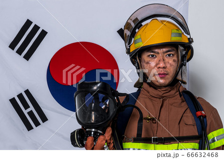 Asian male and female firefighter portrait, young smiling fireman in uniform 497 66632468