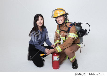 Asian male and female firefighter portrait, young smiling fireman in uniform 428 Asian male and female firefighter portrait, young smiling fireman in uniform 428 66632469