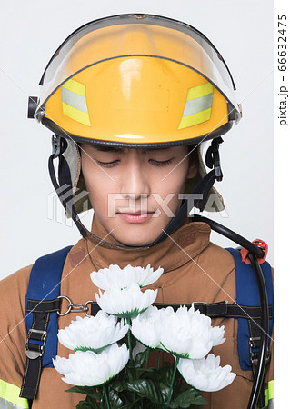 Asian male and female firefighter portrait, young smiling fireman in uniform 401 66632475