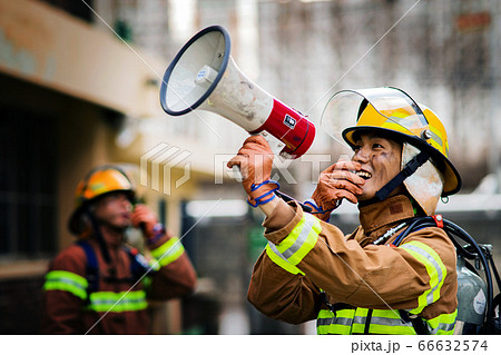 Asian male and female firefighter portrait, young smiling fireman in uniform 327 Asian male and female firefighter portrait, young smiling fireman in uniform 327 66632574