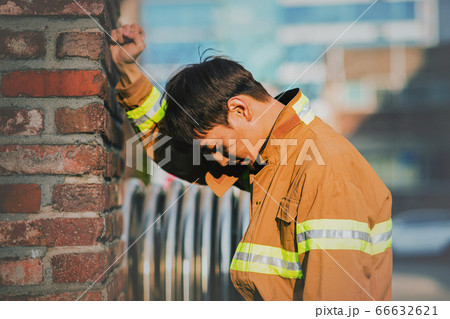 Asian male and female firefighter portrait, young smiling fireman in uniform 381 66632621