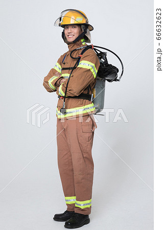 Asian male and female firefighter portrait, young smiling fireman in uniform 416 Asian male and female firefighter portrait, young smiling fireman in uniform 416 66632623