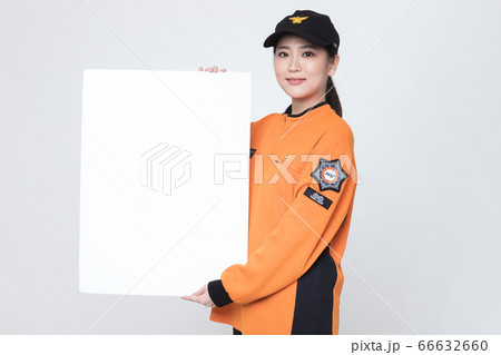 Asian male and female firefighter portrait, young smiling fireman in uniform 407 Asian male and female firefighter portrait, young smiling fireman in uniform 407 66632660