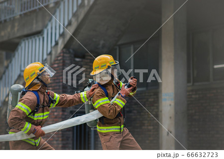Asian male and female firefighter portrait, young smiling fireman in uniform 314 66632723