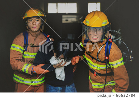 Asian male and female firefighter portrait, young smiling fireman in uniform 292 66632784