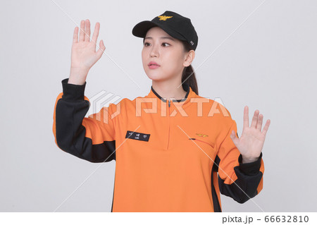 Asian male and female firefighter portrait, young smiling fireman in uniform 186 Asian male and female firefighter portrait, young smiling fireman in uniform 186 66632810