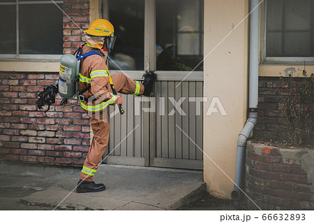 Asian male and female firefighter portrait, young smiling fireman in uniform 299 Asian male and female firefighter portrait, young smiling fireman in uniform 299 66632893
