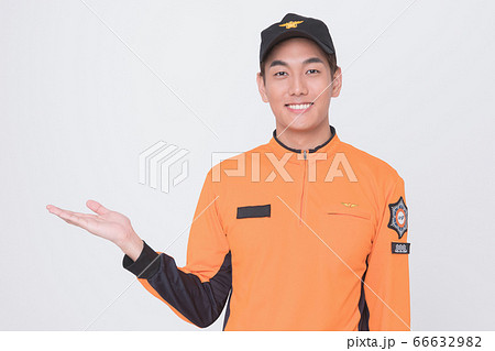 Asian male and female firefighter portrait, young smiling fireman in uniform 071 Asian male and female firefighter portrait, young smiling fireman in uniform 071 66632982
