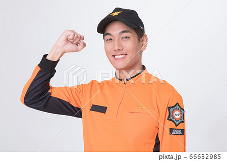 Asian male and female firefighter portrait, young smiling fireman in uniform 031 Asian male and female firefighter portrait, young smiling fireman in uniform 031 66632985