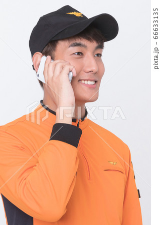Asian male and female firefighter portrait, young smiling fireman in uniform 068 66633135