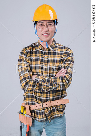 A studio portrait of Asian man making a confident smile 391 A studio portrait of Asian man making a confident smile 391 66633731