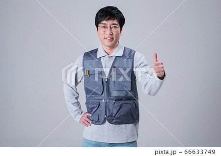 A studio portrait of Asian man making a confident smile 454 66633749