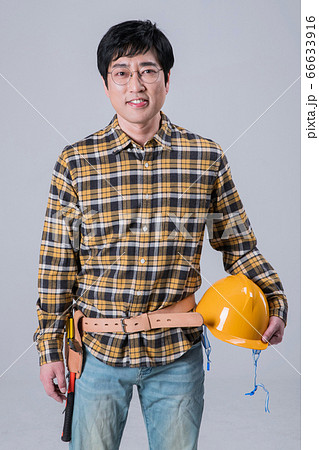 A studio portrait of Asian man making a confident smile 373 66633916