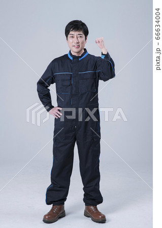 A studio portrait of Asian man making a confident smile 124 A studio portrait of Asian man making a confident smile 124 66634004