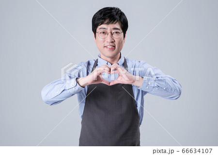 A studio portrait of Asian man making a confident smile 110 A studio portrait of Asian man making a confident smile 110 66634107