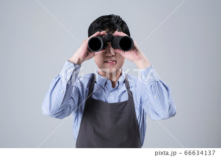 A studio portrait of Asian man making a confident smile 012 66634137