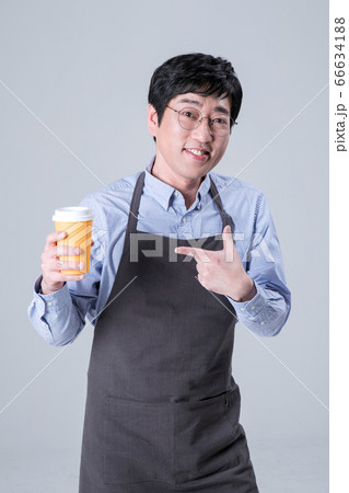 A studio portrait of Asian man making a confident smile 076 66634188