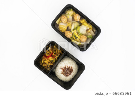 Top view of spicy curry pork with rice and meat ball vegetable soup in black contain box. Top view of spicy curry pork with rice and meat ball vegetable soup in black contain box. 66635961