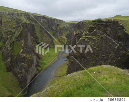 View on river stream and green moss covered cliffs View on river stream and green moss covered cliffs 66636891
