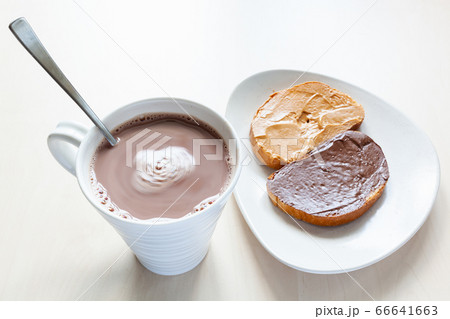 top view of mug with hot chocolate and toasts 66641663