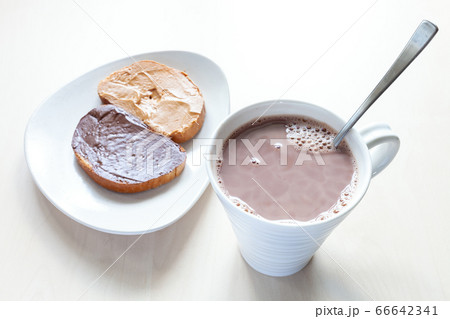 above view of cup with cocoa and toasts on plate above view of cup with cocoa and toasts on plate 66642341