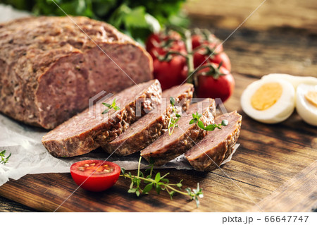 Homemade ground meatloaf with eggs tomatoes celery 66647747