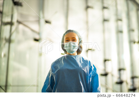 Confident medical doctor in surgical mask and surgical cap Confident medical doctor in surgical mask and surgical cap 66648274