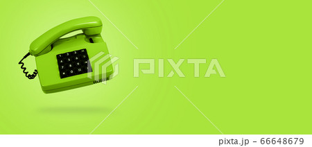 Green landline phone on green background. Banner. 66648679
