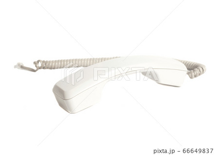 Telephone receiver and cord isolated on white 66649837