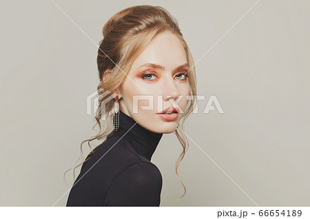 Perfect woman with updo hair wearing black 66654189