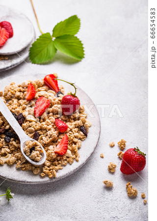 Homemade granola with fresh strawberry Homemade granola with fresh strawberry 66654583